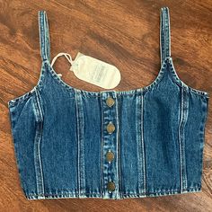 Brand New W/ Tags!! This Is The Cutest Lil Denim Crop! It Has Adjustable Straps And The Quality Is Amazing!! Size Small! I Wear A 34b And This Small Fits Perfect For Reference;)) I Should Be Getting More Sizes In Soon! *Feel Free To Ask Any Questions!! *Made By The Australian Company Ghanda But I’m Listing Under Free People Because Such A Similar Style/Vibe! Blue High Waist Cotton Top, Casual Medium Wash Cropped Crop Top, Trendy Medium Wash Crop Top, Casual Medium Wash Cropped Top, Trendy Denim Blue Crop Top, High Waist Denim Blue Cotton Crop Top, Casual Denim Blue Crop Top For Summer, Trendy Dark Crop Top, Trendy High-waist Denim Tops