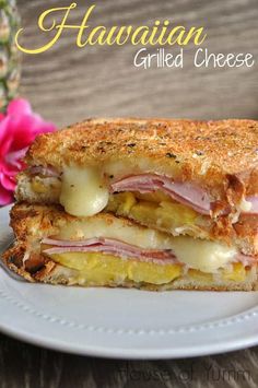 a grilled cheese sandwich on a plate with pink flowers in the background and text overlay that reads hawaiian grilled cheese