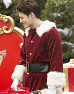 a man and woman dressed as santa clause