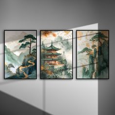 three paintings hanging on the wall in an empty room