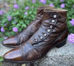 One of many antique shoes we have for sale! A pair of Antique (c1900-1910s) Mens button up boots/shoes. Can be unisex. Deep caramel Brown color in a smooth leather fabric with cotton twill lining. *Refer to last photo and condition comments for notable Issues.  Size: looks like size mens 10 indicated? I wear a womens 7.5-8 and they are a little big for me (long in the toe area) but it is always best to refer to measurements when purchasing Antique shoes.  These boots tend to be more narrow than Victorian Boots With Leather Sole For Formal Wear, Victorian Formal Boots With Leather Sole, Formal Victorian Boots With Leather Sole, Vintage Leather Boots With Buttons, 1912 Shoes, 19th Century Shoes Man, Brown Vintage Adventure Boots, Edwardian Mens Boots, Brown Lace Up Boots Victorian