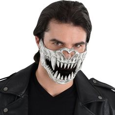 You're instantly creepy in this skull costume accessory for adults. The half mask covers the nose to the chin and looks like the jaws of a terrifying fanged creature. Pair it with a black outfit of your own for an instant horror Halloween look. It has a ribbon closure in back for a comfortable fit. pbAdult Creature Skull Half Mask product details:-b-p ul liRibbon closure-li liPlastic and fabric-li liDoes not include jacket or shirt-li liOne size fits most teens and adults-li -ul Bottom Half Mask, Skull Half Mask, Skull Creature, Pointy Teeth, Skull Costume, Red Cosplay, Dog Skull, Creepy Costumes, Horror Costume