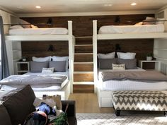 bunk beds in a room with wooden walls