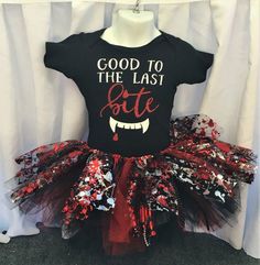 a black shirt with red and white sprinkles that says, good to the last bite