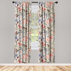 an open window with floral curtains hanging on the wall and wooden flooring in front of it