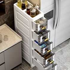 an open drawer in the middle of a kitchen