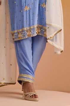 Blue kurta with sequins, dabka, nakshi and zari hand embroidery. Paired with a matching plain pant with embroidered hemline and an embroidered contrasting dupatta. - Aza Fashions Designer Wear Pants With Mirror Work For Eid, Bollywood Style Festive Bottoms With Mirror Work, Festive Bollywood Bottoms With Mirror Work, Traditional Pants With Mirror Work For Eid, Blue Embellished Salwar Kameez For Navratri, Blue Pants With Resham Embroidery For Festive Occasions, Festive Mirror Work Bottoms For Eid, Festive Blue Pants With Resham Embroidery, Festive Eid Bottoms With Mirror Work