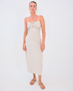 Haya Dress by Desert Queen Evoke timeless elegance with the Haya Dress, skillfully crafted in pristine natural linen. This MIDI dress graces its wearer with a halter top that accentuates the neckline, paired with an alluring keyhole cut out. Perfect for those seeking a blend of classic design and contemporary allure. 100% Linen Desert Queen, March 2024, Natural Linen, Halter Top, Pre Order, Timeless Elegance, Classic Design, Cut Out, Midi Dress