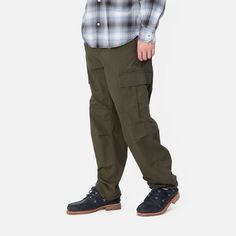 Color: Cypress - The Regular Cargo Pant is made of midweight cotton Columbia ripstop, which has been rinsed for a softer feel. The style is cut in a regular fit with a low waist and features double-layer knees, adding to its robust qualities. Multiple pockets throughout nod to the garment's military-style influences, and tie detailing at the cuffs allow for the fit to be adjusted. The Aviation Pant () offers the same lightweight quality construction with a slimmer fit. _* Columbia ripstop: 100% Military Cargo Work Pants For Outdoor, Military Style Cotton Cargo Pants For Outdoor, Outdoor Full-length Cargo Pants With Patch Pockets, Outdoor 4-way Stretch Cargo Pants, 4-way Stretch Cargo Pants With Functional Pockets For Outdoor, Military Style, Cargo Pant, Carhartt Wip, Low Waist