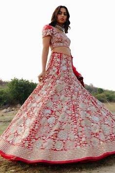 Red lehenga with all-over floral embroidered motifs. Comes with blouse and silk dupatta.
Component: 3
Pattern: Embroidery
Type Of Work: Zari, Beads, Mirror and Sequin
Neckline: Sweetheart
Sleeve Type: Half
Fabric: Lehenga: Organza, Dupatta: Silk and Blouse: Chanderi
Color: Red
Other Details: 
Blouse with scalloped hems
Dupatta with floral embroidered border
Blouse with back tie up
Occasion: Bride - Aza Fashions Zari Lehenga, Organza Embroidery, Embroidered Motifs, Wedding Embroidery, Red Lehenga, Embroidered Border, Organza Dupatta, Pattern Embroidery, Silk Dupatta