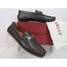 Drulio Brown Smooth Leather Metal Logo Driving Loafers By Bally Made In Italy 100% Authentic,Guaranteed Color: Chocolate (Print On The Box) Calf Soft Leather Upper Stitched Detailed Slip-On Silhouette Squared Moc Toe Metal Lettering Logo Silver Plate Across Vamp Removable "Bally" Stamped Logo Leather Insole Leather Lining Rubber Driver Sole "Bally" Logo At The Back Heel Size Eu 10.5 / Us 11.5 D / Fr 44.5 - Print On The Box Original Price $600 Note!!! These Shoes Came From Bally Store In Its Orig Designer Brown Moccasins With Rubber Sole, Designer Brown Plain Toe Moccasins, Designer Brown Plain Toe Loafers, Designer Brown Loafers With Leather Footbed, Designer Brown Moccasins For Business, Formal Brown Moccasins With Branded Insole, Designer Brown Slip-on Loafers, Designer Brown Formal Moccasins, Elegant Flat Brown Leather Shoes