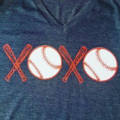 two baseballs and crossed bats on a blue shirt