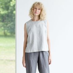 "Sprinkle some colour to your everyday look with the handmade 100% natural linen blouse that makes it an ideal piece for spring-summer. Looks fabulous when tucked into skirts with waistbands. Ideal for the stylish woman on-the-go. Neckline: round Sleeves: no Pockets: no Details: *Oeko-Tex Standard certified linen *Colour shown: grey ice blue (1st picture) *Model is wearing size M *Medium weight *Maternity friendly *Relaxed fit *Not-ironed (and no need to) *Handmade by @LinenCloud Easy care: - Ma Flax Sleeveless Top For Spring, Sleeveless Linen Top For Everyday, Casual Flax Linen Tank Top, Everyday Sleeveless Linen Top, Sleeveless Flax Tops For Spring, Spring Flax Sleeveless Top, Casual Linen Tank Top For Everyday, Spring Sleeveless Flax Tops, Casual Everyday Linen Tank Top