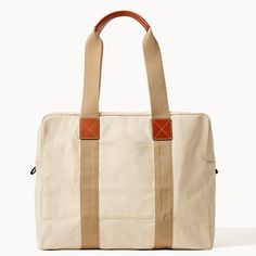 Travel in Style  With this travel-ready look, crafted from 100% Egyptian cotton canvas woven in Italy, you'll be able to pack for days at a time, so get ready to see the world in style. Canvas Weekender Bag With Pockets, Canvas Weekender Bag With Pockets For Weekend Trips, Cotton Weekender Bag For Overnight Trips, Classic Beige Weekender Bag For Travel, Casual Weekender Bag With Waxed Finish For Travel, Casual Waxed Finish Weekender Bag For Travel, Classic Weekender Bag With Canvas Lining, Classic Weekender Bag With Canvas Lining For Weekend Trips, Casual Canvas Travel Bag For Weekend Trips