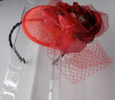 This Red Silk Flower Sinamay Fascinator Hat with Veil and Black Beaded Headband is a beautiful accessory for weddings, parties, cocktail, and other special occasions. It is elegant, stylish, fashionable, and chic! Will definitely add a special touch to your outfit! I only accept PayPal and ship all orders within 24 hours via USPS. Feel free to send me a convo with any questions. Thank you for visiting Hettie Hair Accessories! Elegant Adjustable Fascinator As A Gift, Evening Fascinator With Handmade Flowers And Adjustable Fit, Handmade Flowers Adjustable Fascinator For Evening, Elegant Flower Headpieces For Gifts, Elegant Headpiece With Handmade Flowers, Elegant Headpieces With Handmade Flowers As Gift, Elegant Party Headband With Handmade Flowers, Elegant Headband Fascinator As Gift, Elegant Headband With Handmade Flowers For Party