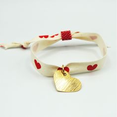 "Introducing our \"Love Red Heart Ribbon Bracelet with Gold Heart Pendant\" - a charming and heartfelt accessory that radiates love and elegance. This intricately crafted bracelet is the perfect expression of affection for Valentine's Day or any special occasion. This Bracelet is ship in an envelope with message card, but if you want to personalize this as a gift please get in contact and we will be happy to help create a message card for you. Key Features: Romantic Design: Adorned with a red he Heart Charm Jewelry For Friendship On Valentine's Day, Heart-shaped Jewelry For Valentine's Day, Valentine's Day Friendship Bracelet Jewelry, Valentine's Day Double Heart Friendship Bracelet, Gold Heart-shaped Friendship Bracelets For Valentine's Day, Valentine's Day Friendship Bracelets With Heart Beads, Friendship Double Heart Bracelets For Valentine's Day, Adjustable Bracelet Jewelry For Valentine's Day, Friendship Bracelets With Double Heart Charm