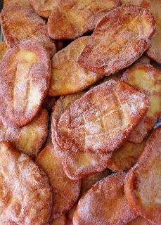 a pile of fried bananas sitting on top of a table