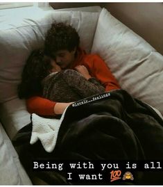 a man and woman cuddling on a couch with the caption being with you is all i want to do