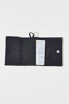 BAGGU snap wallet. This handy trifold wallet from BAGGU features a webbing loop so you can clip it to your keychain, with four card pockets, one bill fold and a snap closure. Made of recycled heavyweight nylon body with recycled ripstop nylon exterior. Features BAGGU nylon wallet Tri-fold design Made with recycled materials Hook & loop closure Content + Care 100% Recycled nylon Machine wash Imported Size Dimensions: 4" l x 3" h | BAGGU Snap Wallet in Black, Women's at Urban Outfitters Snap Wallet, Trifold Wallet, Tri Fold, Recycled Materials, Snap Closure, Urban Outfitters, Wallet, Exterior, Black