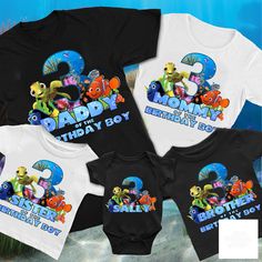 three baby onesuits with cartoon characters on them in front of an ocean background