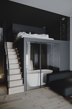 a bathroom with a tub and stairs in it