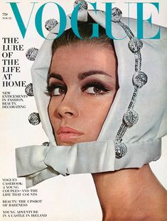 a magazine cover with a woman's face covered by a white scarf and headdress