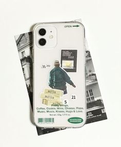 a cell phone case with an image of a man holding a suitcase on top of it