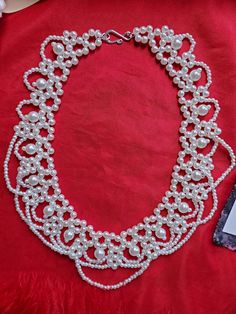 This listing is for a lovely vintage style one-strand festoon glass pearl necklace.  It measures 16 inches long.  I can add a chain to it that will allow you to extend it longer to make it more adjustable.  Just mention that at checkout. Perfect for your everyday or historical/costuming needs.  This necklace spans the test of time, and can be worn for multiple centuries as well as today.  These are hard to find.  I changed the clasp to a silver hook and ring to make it more period appropriate. Y Marie Antoinette Necklace, Vintage Handmade Beaded Necklaces For Wedding, Vintage Pearl Drop Bridal Necklace Gift, Victorian Beaded Wedding Necklace, Victorian Style Wedding Necklaces With Round Beads, Handmade Formal Bridal Necklace With Round Beads, Handmade Bridal Necklace With Round Beads For Formal Occasions, Formal Handmade Bridal Necklace With Round Beads, Handmade Victorian Pearl Necklaces