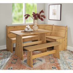 a corner table and bench in a room