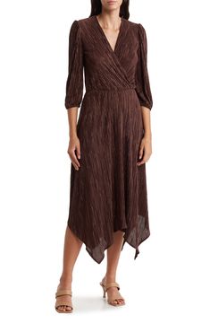 A handkerchief hem and plissé texture add dimension to a stem-baring dress that's perfect for a nicer occasion. 43 1/2" shortest length; 52 1/2" longest length Surplice V-neck Three-quarter sleeves 100% polyester Machine wash, line dry Imported Asymmetrical Hem Pleated Formal Dress, Brown Pleated Evening Dress, Formal Pleated Dress With Asymmetrical Hem, Elegant Brown Pleated Midi Dress, Elegant Fall Dress With Handkerchief Hem, Elegant Handkerchief Hem Fall Dress, Fitted Brown Pleated Midi Dress, Formal Pleated Midi Dress With Asymmetrical Hem, Fitted Dress With Folds And Asymmetrical Hem