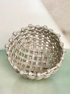 a woven basket sitting on top of a table