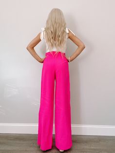 Meet the Paradise Pink Pants from Sassy Shortcake. These bright, neon pink pants are sure to stand out! They feature a hidden back zipper and a flowy fit. Lined true to size, model wearing a size small content: 100% polyester care: hand wash cold Pink Stretch Wide Leg Pants For Spring, Neon Bottoms For Summer Party, Pink High-waisted Wide Leg Pants For Day Out, Pink High-waisted Bottoms For A Day Out, Pink High-waisted Pants For Day Out, Pink Wide Leg Pants For Day Out, Pink Stretch Wide Leg Pants For Summer, Pink Wide Leg Trousers For Day Out, Chic Pink Wide Leg Pants For Summer