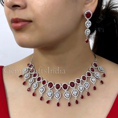 BEAUTIFUL AMERICAN DIAMOND NECKLACE SET *  Main Color : Ruby * Skin Friendly : This Product does not contain harmful constituents. Anti-allergic safe for Skin. * Quality : Made from Premium Quality Material. This Product assures to remain in its Original Glory even after several usages.     . Actual Images of item are shown above, Please be aware of the actual colors may vary from the color shown on your screen, as monitor    settings may vary from individual to individual. . Welcome to Our Etsy Crystal Jewelry Sets For Anniversary On Valentine's Day, Crystal Jewelry Sets For Anniversary And Valentine's Day, Crystal Jewelry For Wedding And Valentine's Day, Valentine's Day Teardrop Jewelry Set With Matching Earrings, Wedding Jewelry Sets For Valentine's Day, Valentine's Day Wedding Jewelry With Matching Earrings, Silver Jewelry Sets For Valentine's Day Wedding, Silver Jewelry Sets For Wedding On Valentine's Day, Cubic Zirconia Jewelry With Matching Earrings For Valentine's Day