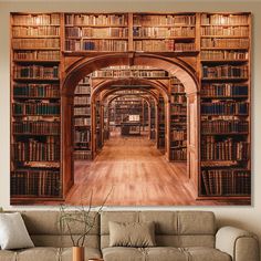 a living room filled with furniture and bookshelves next to a large painting on the wall