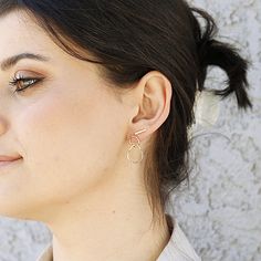 This minimalist double hoop earrings were made of 1.3mm (16 gauge) 10k yellow gold wire. It's hand formed and hammered for texture. MATERIALS and DETAILS ***10k or 14k solid yellow gold wire 1.2mm hammered. (Choose from drop down menu) ***14k solid gold posts and backings. ***Small circle is approx. 10mm diameter ***Bigger hoop is approx. 15mm the longest side. It's not perfect shape circle or oval, it's twisted hand forged imperfect organic shape. Every piece is organic and unique -- no two ear Double Hoop Earrings, Small Circle, Jewelry Studio, Gold Wire, Gold Hoops, Circle Earrings, Gorgeous Earrings, Organic Shapes, Solid Yellow