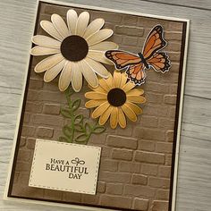 a card with flowers and butterflies on it