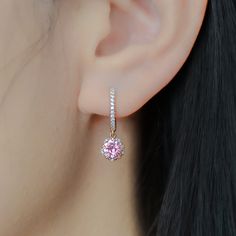 Whimsical yet elegant, Hanaka features a pair of blush-pink Rosé sapphires cut in the shape of an open blossom and framed by petals of glistening moissanites. In the drop style, the blooms dangle delicately from studded huggie hoops, adding a touch of elegance to the delightful spirit of spring. Made to order. Please allow 6-8 weeks for delivery. DETAILS: Gemstone: Type: Sapphire (cultured) Size: 6 mm (each) Color: Rosé Pink Cut: Blossom Design: Style: Drop Accents: Round Brilliant Moissanites B Rosé Pink, Blossom Design, 8 Weeks, Design Style, Round Brilliant, Pink Rose, Pink Roses, Blush Pink, Solid Gold