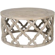 a round wooden table with an intricate design