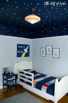 a child's bedroom with stars painted on the ceiling