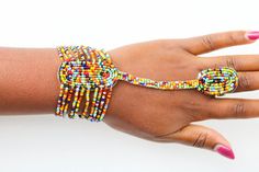 African beaded bracelets, Zulu Bracelets, Maasai Wrist bracelets, Beaded Cuff bracelets, Women jewelry, Christmas gift for her, Moms gift The bracelet is made by the Maasai women in Kenya.  It is beautiful and can compliment any outfit. Bracelet Circumference: 8 inches wide Fits a standard wrist size of 7.5 inches. If you have a larger wrist, please let me know. *Please choose your color* Shipping fee is for the first item only. Other items ship for FREE! Shipping via DHL Express that takes 3-5 Adjustable Bangle With Round Beads For Festivals, Adjustable Colorful Beads Jewelry For Festivals, Adjustable Colorful Beaded Festival Jewelry, Adjustable Colorful Beaded Jewelry For Festivals, Traditional Tiny Beads Bracelet, Multicolor Beaded Bangle For Festival, Multicolor Cuff Bracelet For Festivals And Gifts, Multicolor Bangle With Colorful Beads For Festival, Multicolor Cuff Bracelet As Gift For Festivals