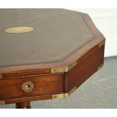 We are delighted to offer for sale this The Revolving Military Campaign Regency Style Drum Side End Table by Bevan Funnell   It is a unique and elegant piece of furniture that combines historical military design with classic Regency style.  Inspired by traditional military campaign furniture used by officers during the 18th and 19th centuries, this side end table features a distinctive drum-shaped design. The table is crafted from high-quality wood, which is known for its rich colour and fine gr Drum Side Table, Campaign Furniture, Side End Table, Military Design, End Table, Rich Color, End Tables, Drums, Side Table