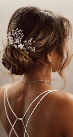 a woman wearing a bridal hair comb