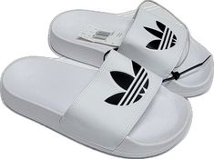 White Synthetic Slip-on Slippers, White Non-slip Beach Slippers, Casual White Vacation Slippers, Comfortable White Slip-on Sandals, White Adjustable Non-slip Sandals, Sporty White Sandals For Vacation, Casual White Slip-on Flip Flops, Trendy White Beach Slippers, White Non-slip Slippers For Vacation