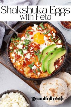 an egg and avocado dish in a cast iron skillet with bread on the side