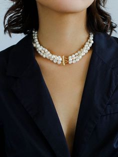 Our Multilayer Steamed Bun Pearl Necklace: a luxurious, timeless, and elegant piece featuring 18K gold plating and selected flat oval freshwater pearls. Add a touch of sophistication to your look with a comfortable 40cm length and dynamic multilayer design. Elevate your style with this perfect fusion of craftsmanship and natural beauty. Metal: 18K Recycled Gold Plated On Brass Pearl: Freshwater Pearl 6-7mm Necklace length 400mm Weight:73g Elegant Double Strand Gold Pearl Necklace, Elegant Double Strand Pearl Necklace For Layering, Elegant Gold Double Strand Pearl Necklace, Elegant Multi-strand Pearl Necklace With Charm, Luxury Gold Pearl Choker Necklace, Luxury Gold Double Strand Pearl Necklace, Elegant Pearl Necklace With Charm For Layering, Elegant Layering Pearl Necklace With Charm, Luxury Pearl Choker Necklace