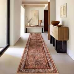 the hallway is clean and ready for guests to use it as an entrance way into the house