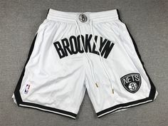 White Athletic Shorts For Basketball Season, Collegiate White Bottoms For Sports Events, White Shorts For Basketball, Summer Basketball Sportswear Bottoms, Summer Sportswear Bottoms For Basketball, White Team Spirit Athletic Shorts For Sports, White Sports Bottoms With Letter Print, White Athletic Shorts For Sports With Team Spirit, Sports Bottoms With White Letter Print