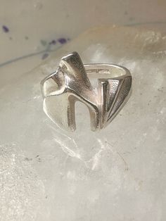 Bjorn Weckstrom ring size 6.25 band sterling silver women circa 1970's Size 6.25 Between a size 6.25 and a size 6.50 Weight. 16.1g Length.  1" Thinnest pat of band 1/4"  Free Shipping & Free Postal Insurance Delivered in a Gift Box  If one wants the ring polished just send me a message at the time of purchase and I will polish the ring with a polishing cloth  Free First Class shipping and postal insurance is included. If you want to upgrade to priority kindly pay an additional fee to do so. This Jewelry Piercing, Body Jewelry Piercing, Jewelry Fashion Trends, Rings Statement, Body Jewelry, Favorite Jewelry, Statement Rings, Jewelry Rings, Universe