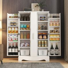 a white cabinet filled with lots of food and drinks next to a couch in a living room