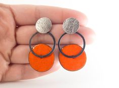 Orange drop earrings. Contemporary earrings. Geometric earrings. Circle drop earrings. Modern silver earrings. Enamel earrings. Women gift Modern orange earrings of silver and enamel. From the Pètals collection. These pieces are a one-of-a-kind handmade earrings. Measures: 43mm length and 23mm width. You can choose and customize the color of the enamel. And also the silver finish. Closure: push back. Very comfortable and lighweight. These modern earrings are ideal for to wear every day! These ge Modern Orange Sterling Silver Jewelry, Modern Silver Earrings With Black Enamel, Orange Metal Earrings As Gift, Orange Metal Earrings As A Gift, Modern Black Enamel Earrings For Gift, Modern Black Enamel Earrings As Gift, Modern Nickel-free Enamel Jewelry, Orange Enamel Earrings As A Gift, Orange Enamel Earrings For Gifts